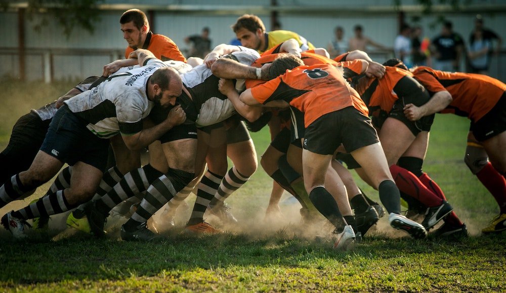 A group of rugby players in a scrum