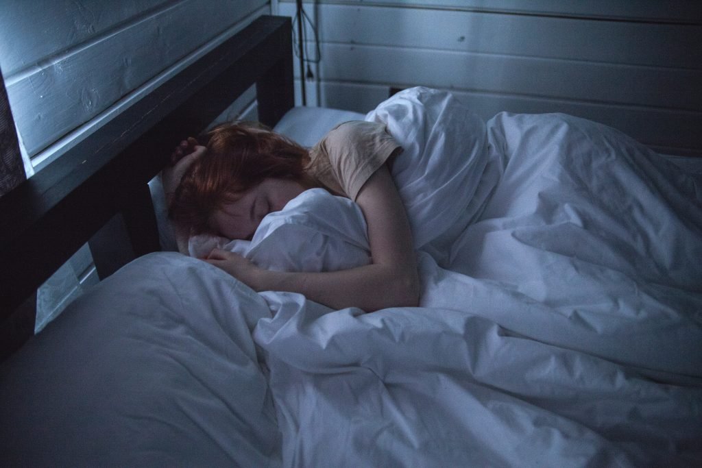 Woman sleeping relaxed in bed