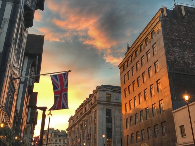 A Union Jack UK flag in London during sunset